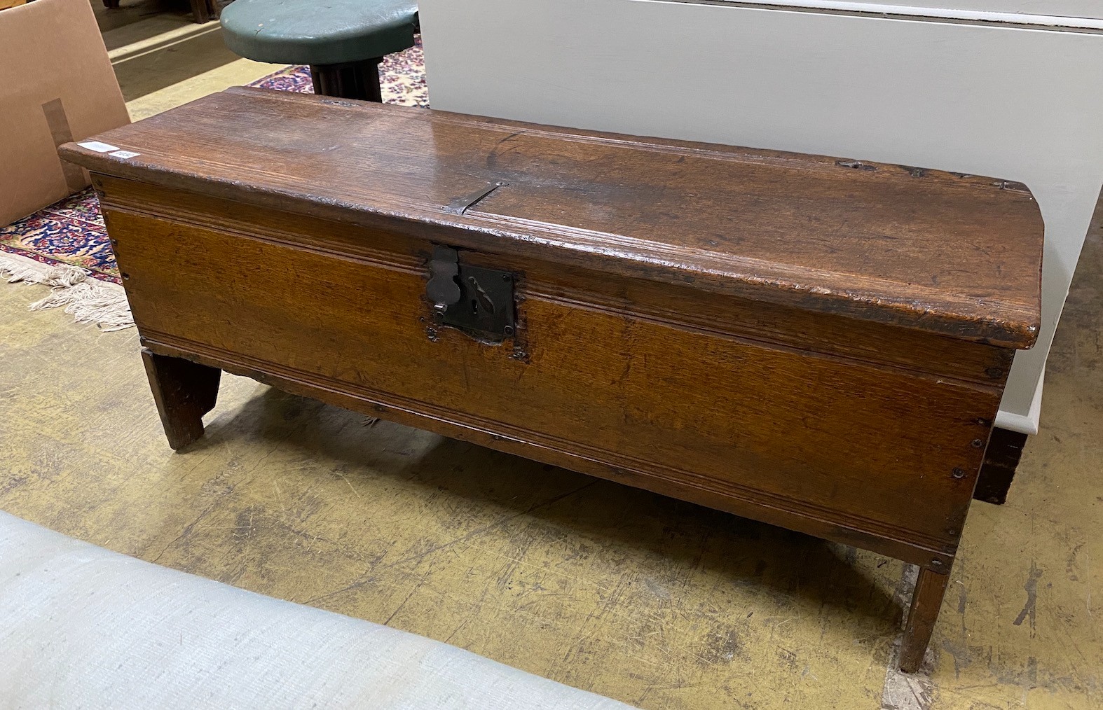 A 17th century oak six plank coffer, length 112cm, depth 32cm, height 48cm